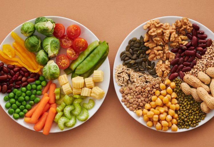 A vibrant flatlay of colorful vegetables and nuts showcasing a balanced diet concept.